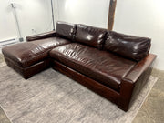 Restoration Hardware Maxwell leather sectional sofa shown from a low front view